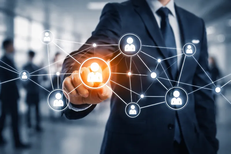 Business professional interacting with digital network of people for blockchain solutions.